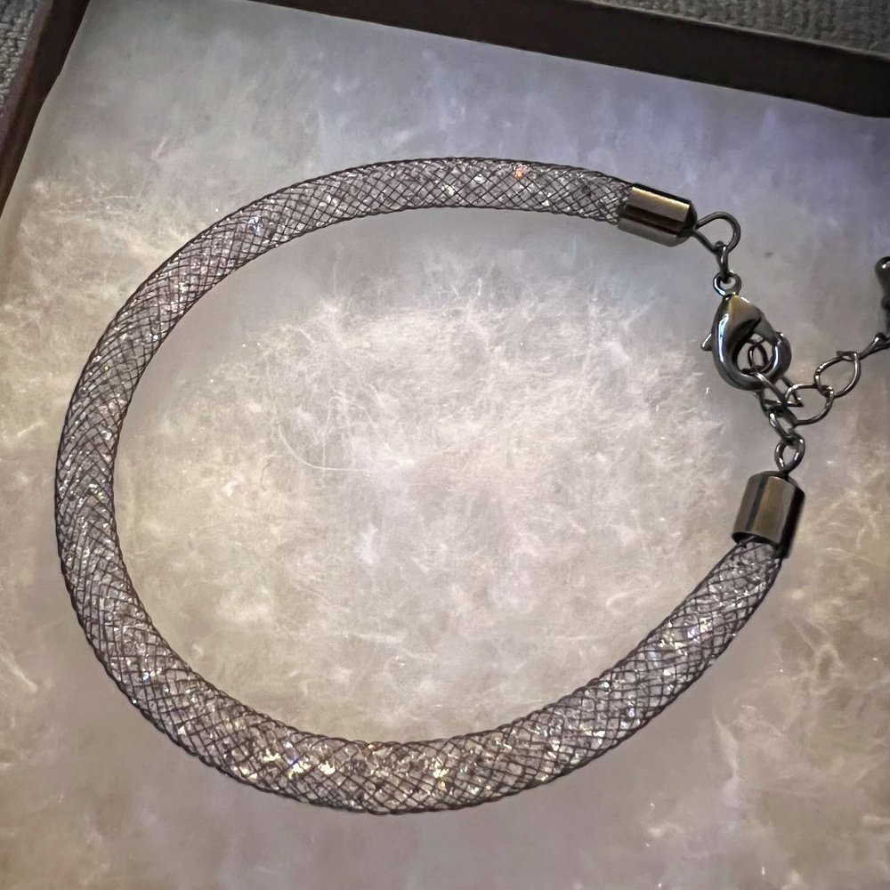 Silver chrome bracelet with Swarovski Crystals. New with box!